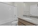 Bright bathroom features a shower-tub combo and granite-topped vanity at 21202 E 63Rd Dr, Aurora, CO 80019