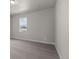 Neutral bedroom with plush carpeting and a large window with a view at 21202 E 63Rd Dr, Aurora, CO 80019