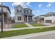 Charming two-story home with a red door, landscaped yard, and concrete walkway, and a fire hydrant nearby at 21202 E 63Rd Dr, Aurora, CO 80019