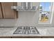 Kitchen with stainless steel gas cooktop and range hood; granite countertops at 21202 E 63Rd Dr, Aurora, CO 80019