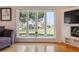 Living room featuring a large window providing plenty of natural light and outdoor scenery at 7641 S Rosemary Cir, Centennial, CO 80112