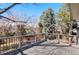 Spacious deck with railings providing views of the surrounding landscape and backyard at 7647 S Crocker Ct, Littleton, CO 80120