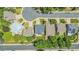 Overhead shot of the property and surrounding neighborhood with mature trees lining the streets and well-manicured lawns at 14185 W Warren Cir, Lakewood, CO 80228