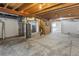 Unfinished basement with exposed beams and concrete floors at 14185 W Warren Cir, Lakewood, CO 80228