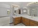Dual sink bathroom with walk-in shower at 14185 W Warren Cir, Lakewood, CO 80228
