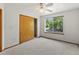 Cozy bedroom featuring a large window and closet at 14185 W Warren Cir, Lakewood, CO 80228