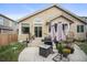 A backyard patio with a grill, planters, and various seating options perfect for outdoor relaxation at 6581 W Alamo Dr, Littleton, CO 80123