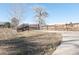 Walking path with small bridge and safety fences to the right, surrounded by natural landscaping at 9680 Brentwood Way # 202, Broomfield, CO 80021