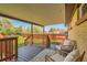 Inviting back deck with outdoor seating and a view of the fenced yard at 3871 Moore St, Wheat Ridge, CO 80033