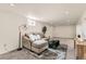 Cozy basement living area with comfortable seating and a stylish area rug at 3871 Moore St, Wheat Ridge, CO 80033