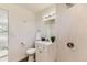 Contemporary bathroom with a white vanity, toilet, and a walk-in shower with white tiling at 3871 Moore St, Wheat Ridge, CO 80033