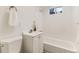 Bright bathroom featuring a shower-over-tub setup and white vanity at 3871 Moore St, Wheat Ridge, CO 80033