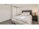 Serene bedroom features a comfortable queen-size bed and ample closet space at 3871 Moore St, Wheat Ridge, CO 80033