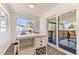 Bright breakfast nook with modern breakfast bar and sliding door to deck at 3871 Moore St, Wheat Ridge, CO 80033