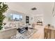 Bright living room with modern furnishings, hardwood floors, and an open layout at 3871 Moore St, Wheat Ridge, CO 80033