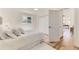 Bright main bedroom with hardwood floors, closet, and plenty of natural light at 3871 Moore St, Wheat Ridge, CO 80033