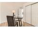 Home office boasts a modern desk setup and convenient closet access for seamless organization at 3871 Moore St, Wheat Ridge, CO 80033