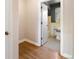 Hallway view into the bathroom with subway tile and a window at 1321 E 10Th Ave # 4, Denver, CO 80218