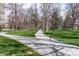 Scenic paved path winding through a lush green city park with mature trees at 1321 E 10Th Ave # 4, Denver, CO 80218
