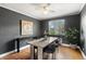 Modern dining room with a large table, stylish chairs, and natural light from a window at 1321 E 10Th Ave # 4, Denver, CO 80218