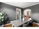 Elegant dining area features an archway to the living room, modern furniture, and gray walls at 1321 E 10Th Ave # 4, Denver, CO 80218