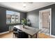 Bright dining room with a wooden table, comfortable seating, and a view of the neighborhood at 1321 E 10Th Ave # 4, Denver, CO 80218