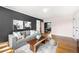 Open-concept living room with a cozy sofa, hardwood floors, and an inviting atmosphere at 1321 E 10Th Ave # 4, Denver, CO 80218