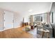 Bright living room featuring hardwood floors, a gray sofa, modern decor, and natural light at 1321 E 10Th Ave # 4, Denver, CO 80218