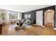 Inviting living room features hardwood floors, a cozy gray sofa, and ample natural light from a large window at 1321 E 10Th Ave # 4, Denver, CO 80218