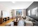 Comfortable living room with stylish decor, a plush sofa, and a view of the outdoors at 1321 E 10Th Ave # 4, Denver, CO 80218