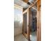 Secure storage cage with wire mesh and a wooden frame, lit by a bright window at 1321 E 10Th Ave # 4, Denver, CO 80218