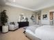 Elegant bedroom featuring a comfortable seating area, decorative furniture, and neutral decor at 18940 E 96Th Pl, Commerce City, CO 80022