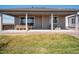 A covered patio with a dining table is a perfect space for entertaining at 18940 E 96Th Pl, Commerce City, CO 80022