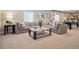 Spacious living room with comfortable seating, contemporary decor, and ample space for entertaining at 18940 E 96Th Pl, Commerce City, CO 80022