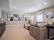 Comfortable living room featuring contemporary decor, neutral color scheme, and lots of light at 18940 E 96Th Pl, Commerce City, CO 80022
