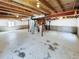 Unfinished basement with utilities, painted floors, and exposed ceiling at 5966 S Winnipeg St, Aurora, CO 80015