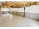Unfinished basement with painted floor and exposed ceiling, ready to be transformed at 5966 S Winnipeg St, Aurora, CO 80015
