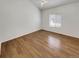 Well-lit bedroom with hardwood floors and a window at 5966 S Winnipeg St, Aurora, CO 80015