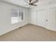Bright bedroom features a ceiling fan, closet, and neutral carpet with natural light from the window at 5966 S Winnipeg St, Aurora, CO 80015
