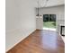 Dining room with a sliding door to the backyard and contemporary light fixture at 5966 S Winnipeg St, Aurora, CO 80015