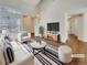 Bright living room featuring vaulted ceilings, natural light, and stylish decor at 5966 S Winnipeg St, Aurora, CO 80015