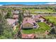 Home aerial with lush lawn, mature trees, and detached garage, offering a private backyard and charming neighborhood setting at 15325 W 32Nd Ave, Golden, CO 80401
