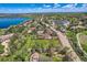 Overhead image of a picturesque neighborhood beside a sparkling lake, offering scenic views and tranquil living at 15325 W 32Nd Ave, Golden, CO 80401