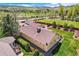 Aerial view of home showcasing well-maintained landscaping, spacious yard, proximity to park, and convenient detached garage at 15325 W 32Nd Ave, Golden, CO 80401