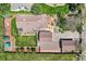 Aerial perspective showcases the property, including the backyard, patios, landscaping, and detached garage at 15325 W 32Nd Ave, Golden, CO 80401