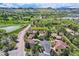 Stunning aerial shot of a neighborhood with lush greenery and beautiful mountain views on the horizon at 15325 W 32Nd Ave, Golden, CO 80401