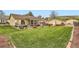 Expansive backyard featuring a lush lawn, covered patio, and charming landscaping at 15325 W 32Nd Ave, Golden, CO 80401
