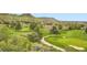 Expansive golf course featuring rolling greens, mature trees, and scenic mountain views at 15325 W 32Nd Ave, Golden, CO 80401