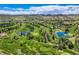 Breathtaking aerial view of a meticulously maintained golf course with serene water features and lush fairways at 15325 W 32Nd Ave, Golden, CO 80401