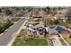 A wide shot of the home shows off its professional landscaping and large yard at 5455 E Cedar Ave, Denver, CO 80246